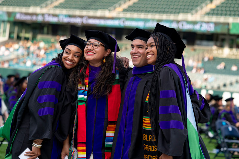 Law grads pose for photo at Yulman Stadium