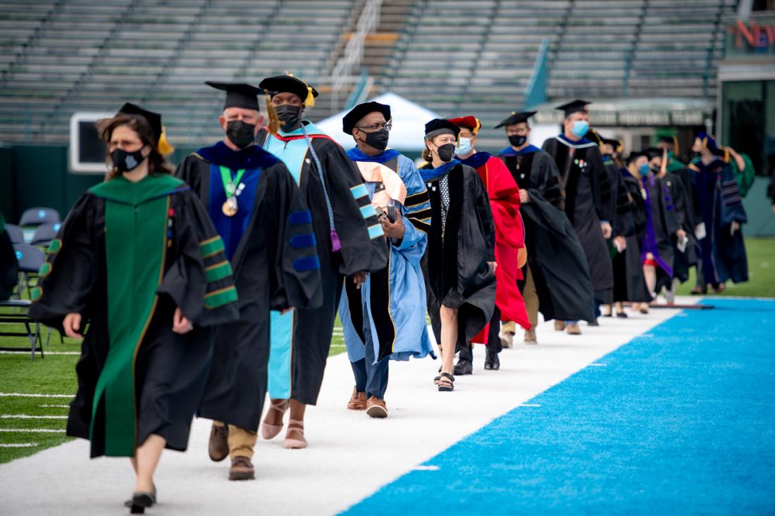 Faculty process into Yulman Stadium for Commencement
